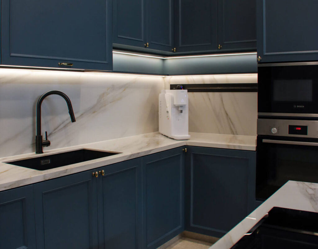 Modern island kitchen layout in a landed home designed by Homescape