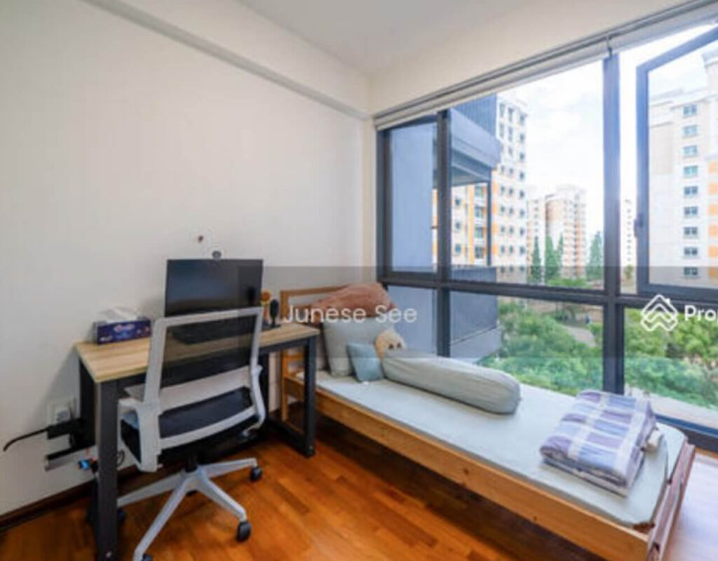 conventional living room layout is divided by walls and a narrow walkway that leads to the bedrooms