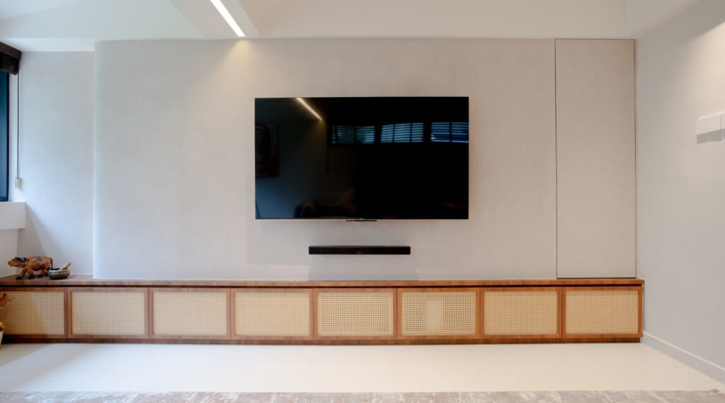 Rattan and wood natural material palette in a minimalist living room